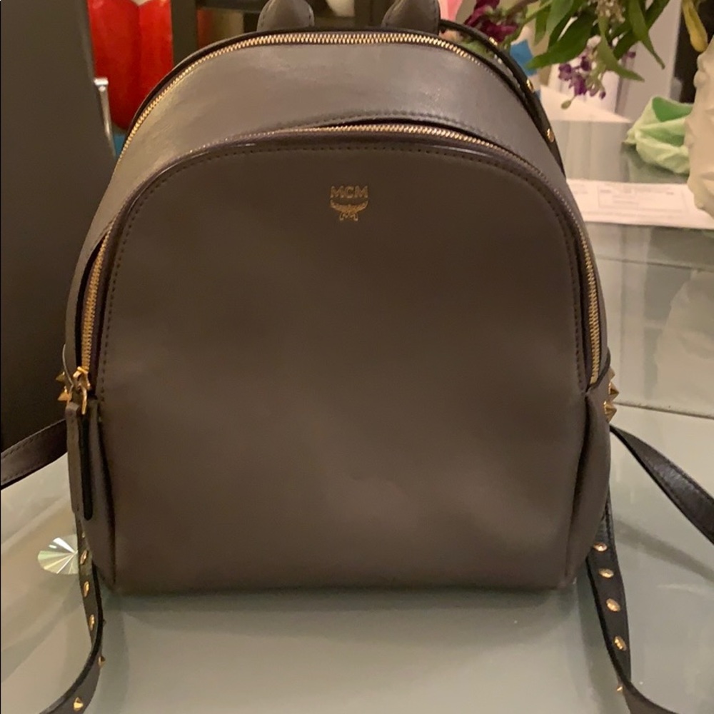 MCM small grey backpack with gold studs